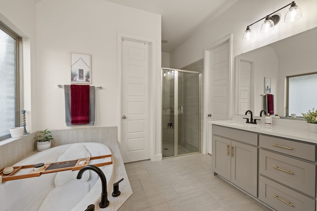 full bath featuring vanity, a shower stall, and a bath