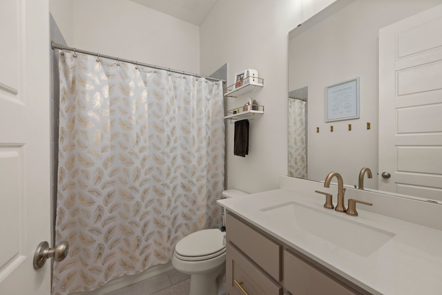 bathroom featuring a shower with curtain, toilet, vanity, and tile patterned flooring