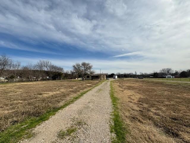 view of street featuring a rural view and driveway