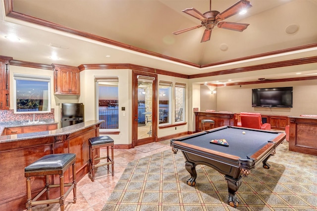 playroom with ornamental molding, billiards, a raised ceiling, ceiling fan, and vaulted ceiling