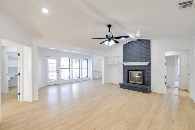 unfurnished living room with visible vents, light wood-style flooring, a ceiling fan, lofted ceiling with beams, and a brick fireplace