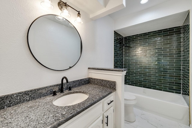 bathroom with vanity, shower / bathing tub combination, toilet, a textured wall, and marble finish floor