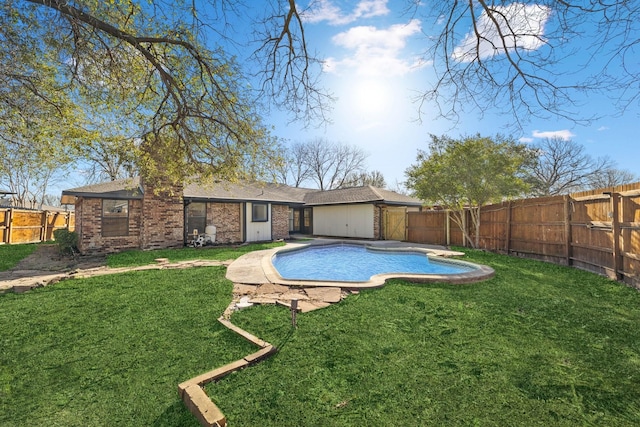 view of swimming pool with a yard, a fenced backyard, and a fenced in pool