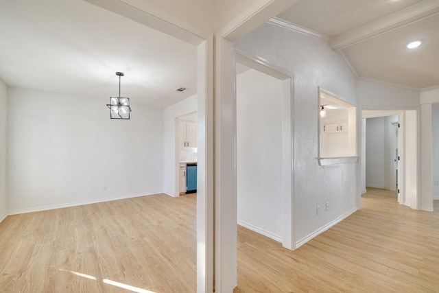 interior space featuring lofted ceiling with beams, light wood-type flooring, baseboards, and visible vents