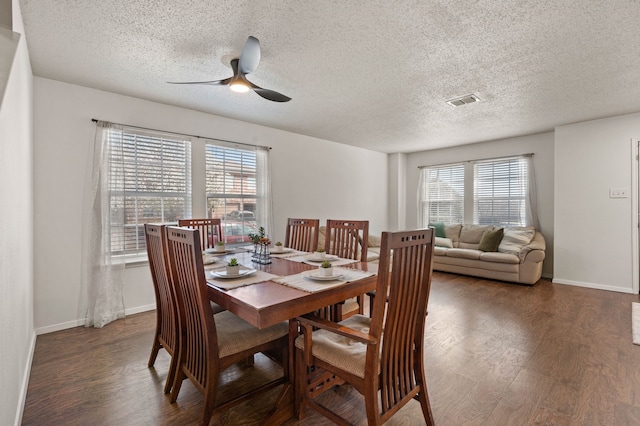 dining area with visible vents, baseboards, ceiling fan, and wood finished floors