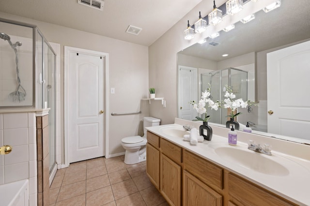 full bathroom with a sink, visible vents, a shower stall, and tile patterned flooring