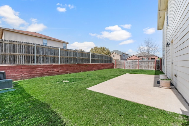 view of yard featuring a patio and a fenced backyard