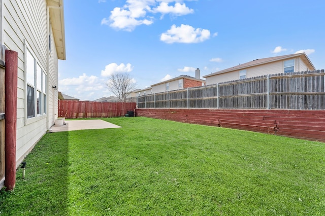 view of yard featuring a patio and a fenced backyard