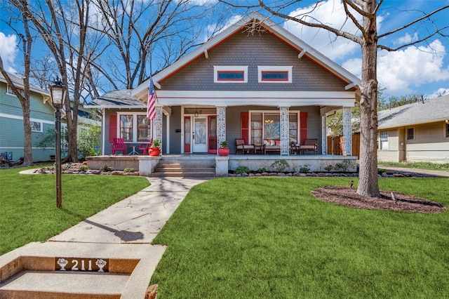 view of front facade with a porch and a front yard