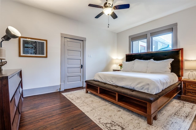 bedroom featuring ceiling fan and dark wood-style flooring