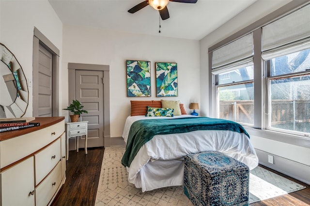 bedroom with wood finished floors and a ceiling fan