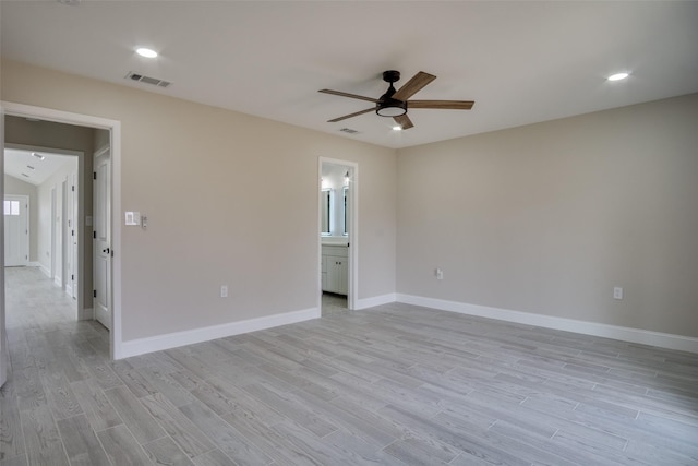 empty room featuring visible vents, recessed lighting, light wood-style floors, baseboards, and ceiling fan