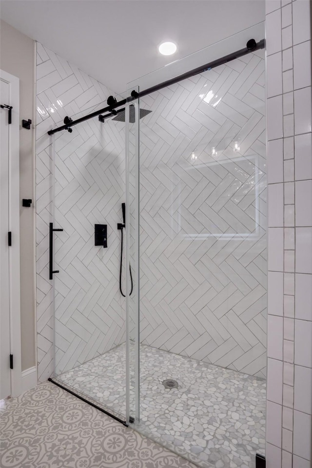 bathroom featuring a shower stall