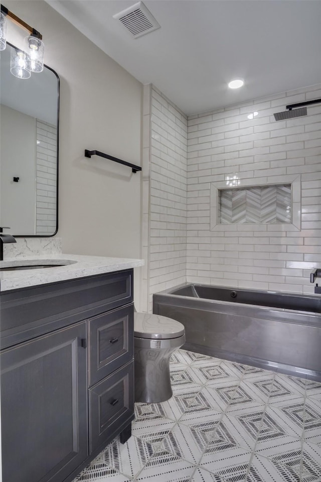 full bathroom featuring visible vents, toilet, and vanity