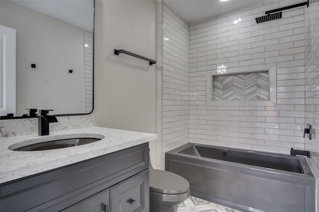 bathroom featuring toilet, bathtub / shower combination, and vanity