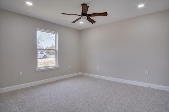 carpeted empty room featuring a ceiling fan, recessed lighting, and baseboards