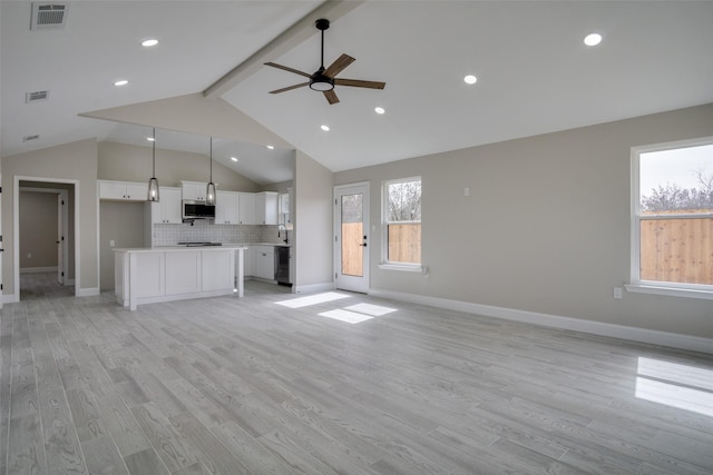 unfurnished living room featuring visible vents, baseboards, light wood-style flooring, ceiling fan, and beamed ceiling