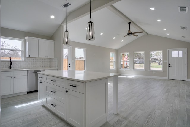 kitchen with a sink, visible vents, and stainless steel dishwasher