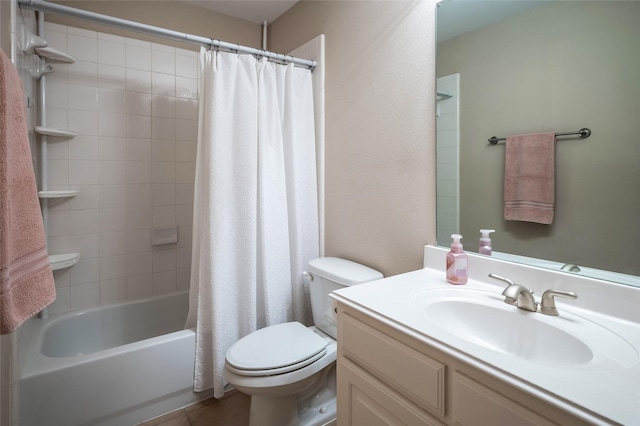 bathroom featuring tile patterned floors, vanity, toilet, and shower / bath combo with shower curtain