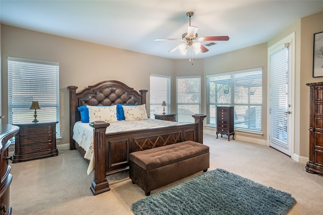 bedroom featuring baseboards, visible vents, ceiling fan, access to exterior, and light carpet