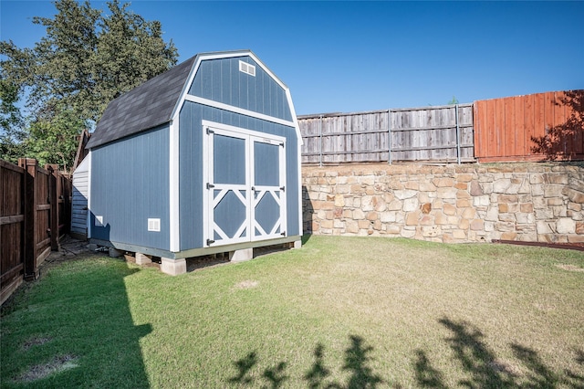 view of shed with a fenced backyard