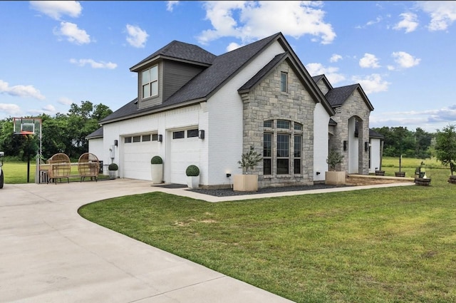 view of home's exterior featuring concrete driveway, roof with shingles, a lawn, stone siding, and an attached garage