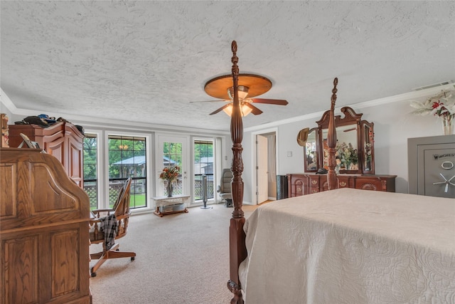 bedroom featuring visible vents, ornamental molding, access to outside, a textured ceiling, and carpet