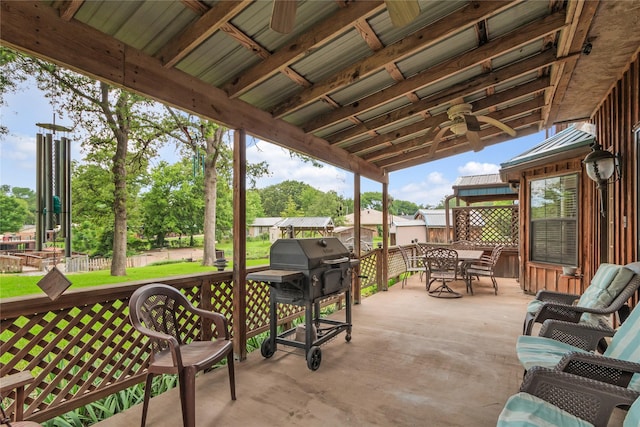 view of patio featuring outdoor dining area and a grill