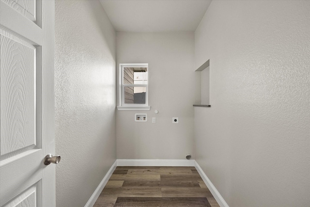 clothes washing area with laundry area, electric dryer hookup, baseboards, and wood finished floors