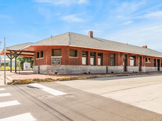 view of property with an attached carport