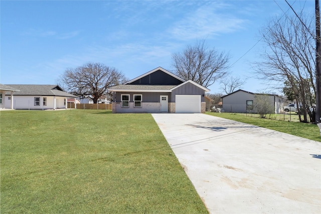 view of front facade with a front yard, fence, driveway, an attached garage, and board and batten siding