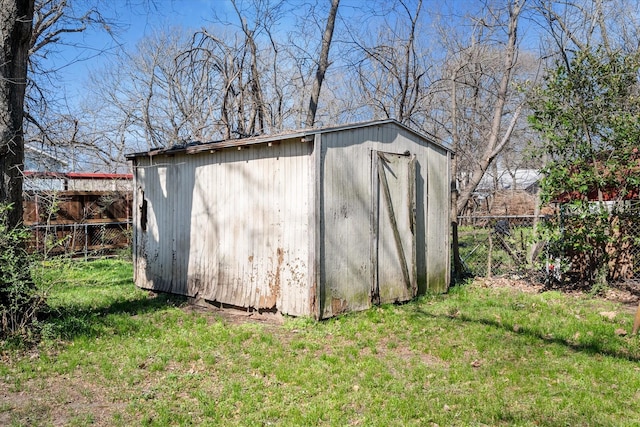 view of shed with fence