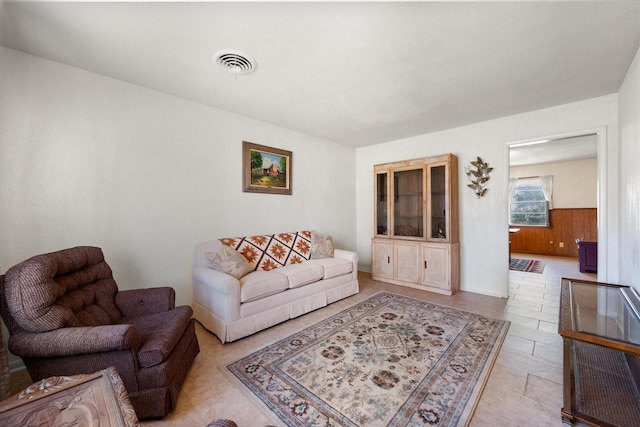 living room featuring visible vents