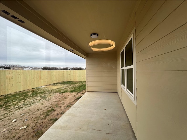 view of patio featuring fence