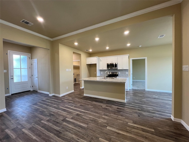 kitchen with visible vents, a center island with sink, white cabinetry, stainless steel appliances, and dark wood-style flooring