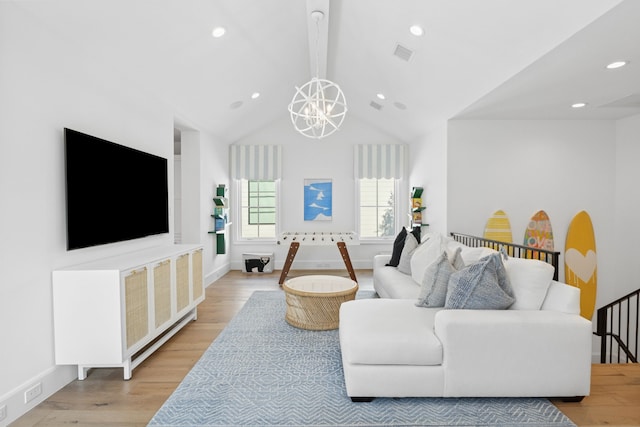 living area with baseboards, visible vents, light wood finished floors, vaulted ceiling with beams, and recessed lighting