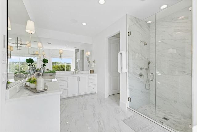 bathroom with a marble finish shower, baseboards, recessed lighting, marble finish floor, and vanity