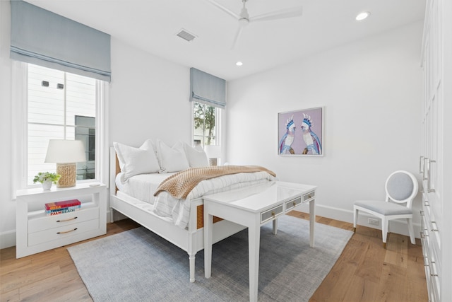 bedroom featuring baseboards, visible vents, recessed lighting, ceiling fan, and light wood-style floors