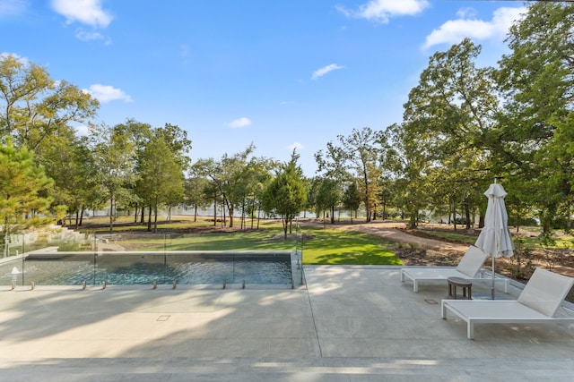 view of home's community featuring a patio and a yard