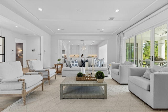 living room with an inviting chandelier, recessed lighting, and visible vents