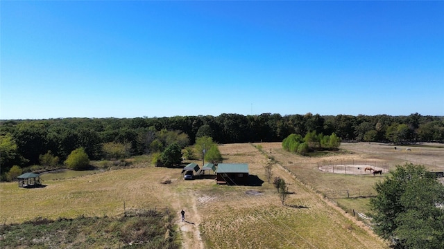 bird's eye view with a rural view and a wooded view