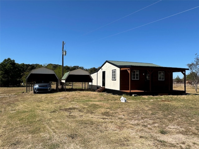 view of yard featuring a garage and entry steps