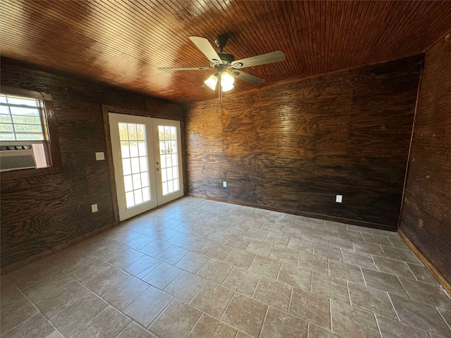 spare room with wood ceiling, cooling unit, french doors, and ceiling fan