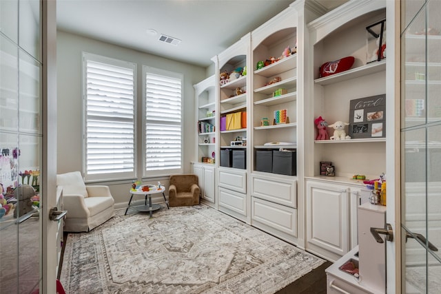 living area featuring visible vents