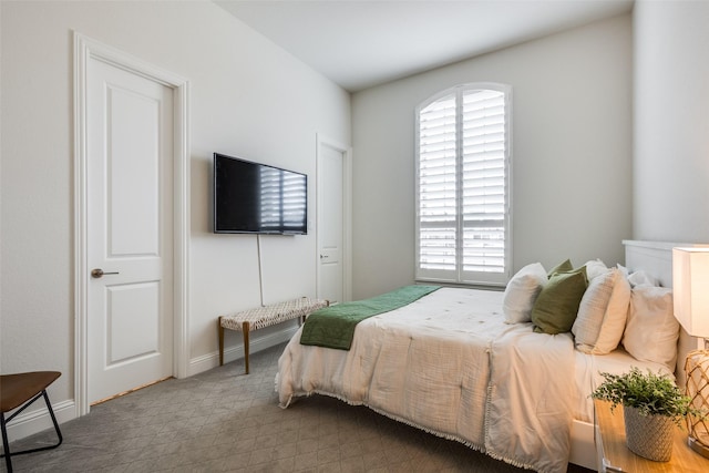 carpeted bedroom with baseboards