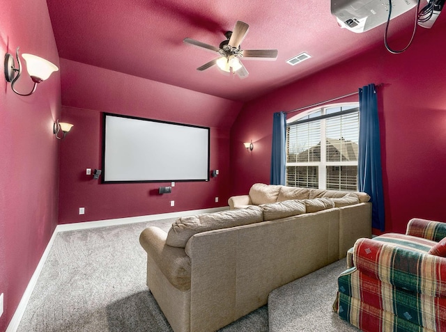 home theater featuring visible vents, a ceiling fan, a textured ceiling, carpet floors, and baseboards