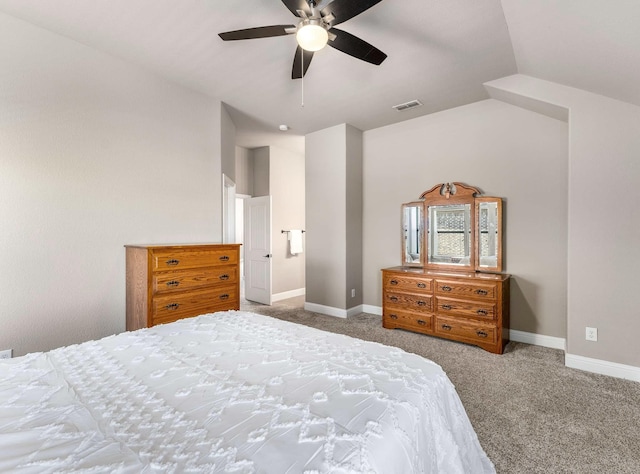 bedroom with vaulted ceiling, carpet flooring, baseboards, and visible vents