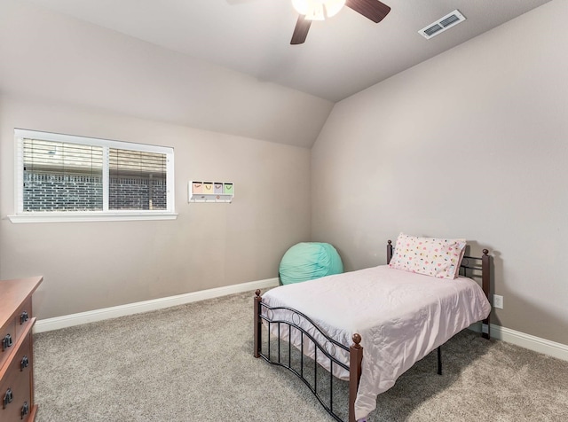 bedroom featuring visible vents, a ceiling fan, carpet, baseboards, and vaulted ceiling