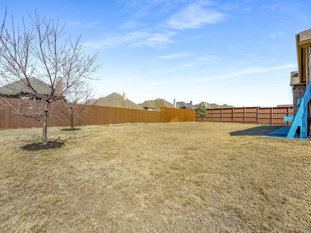 view of yard featuring a fenced backyard