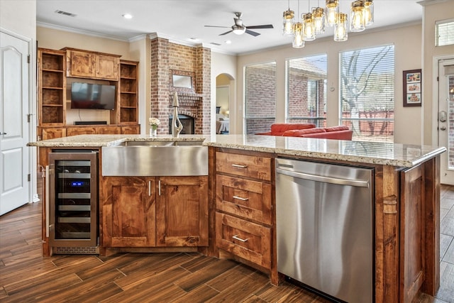 kitchen with visible vents, a sink, open floor plan, wine cooler, and dishwasher